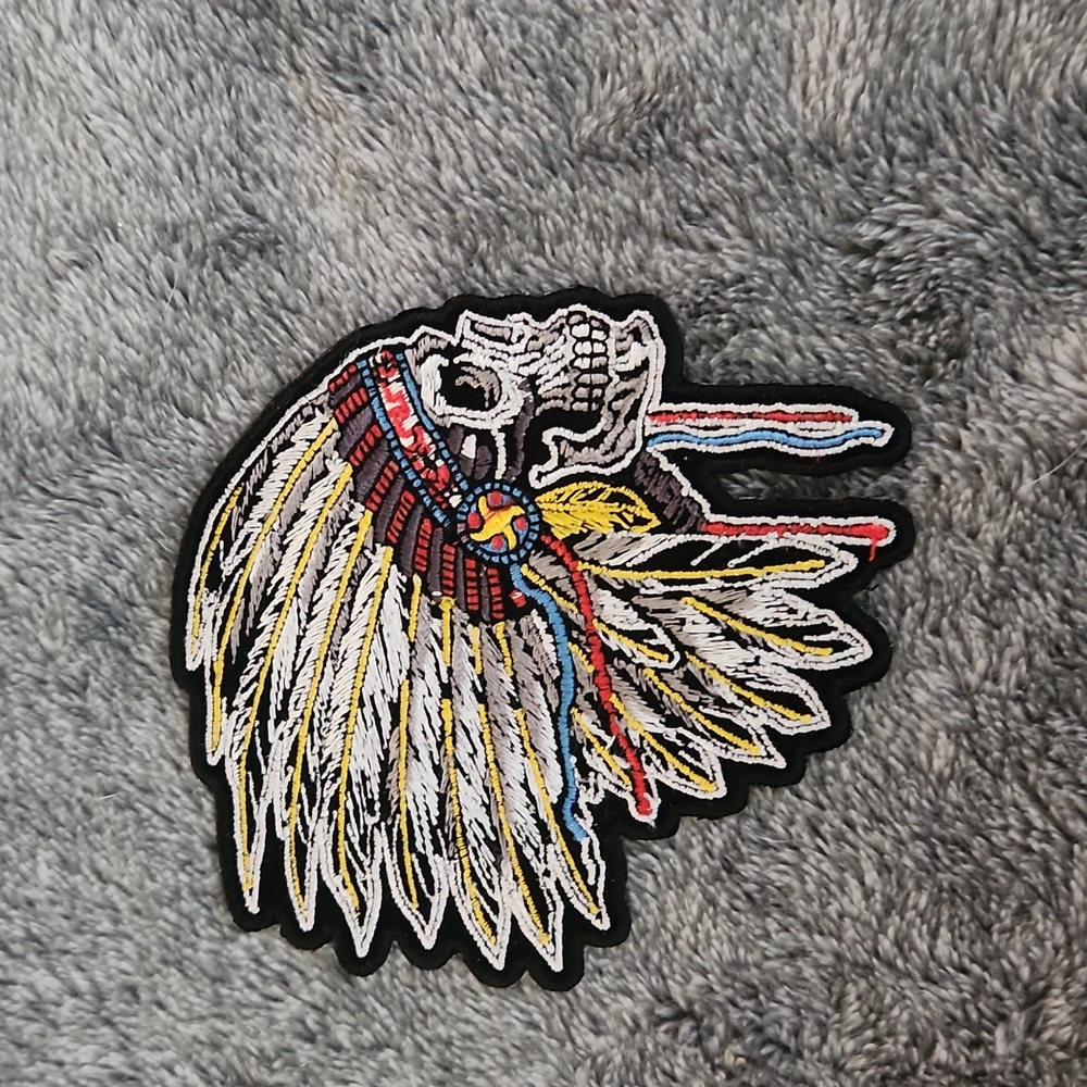 Skull with native feather headdress iron on